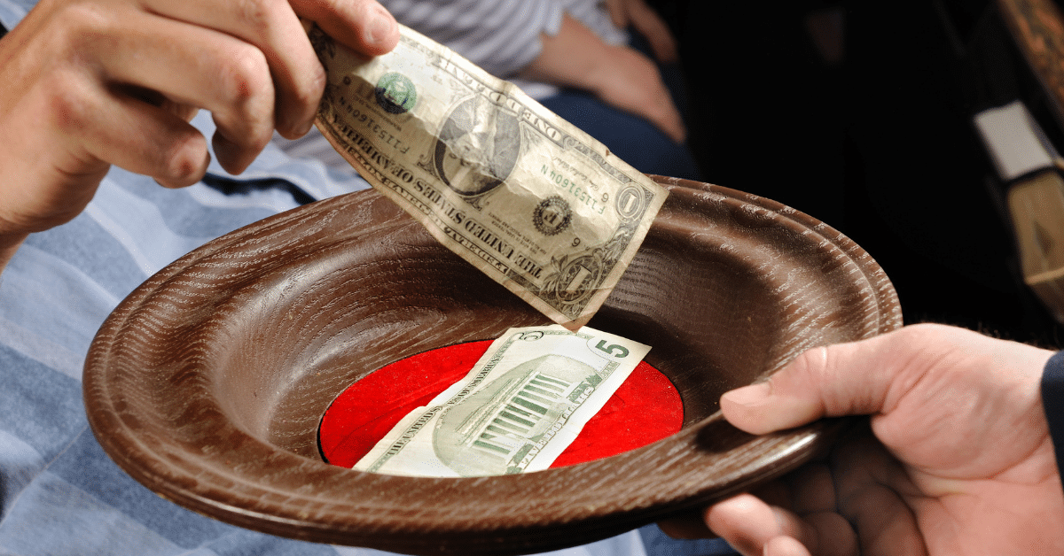money in a church offering plate